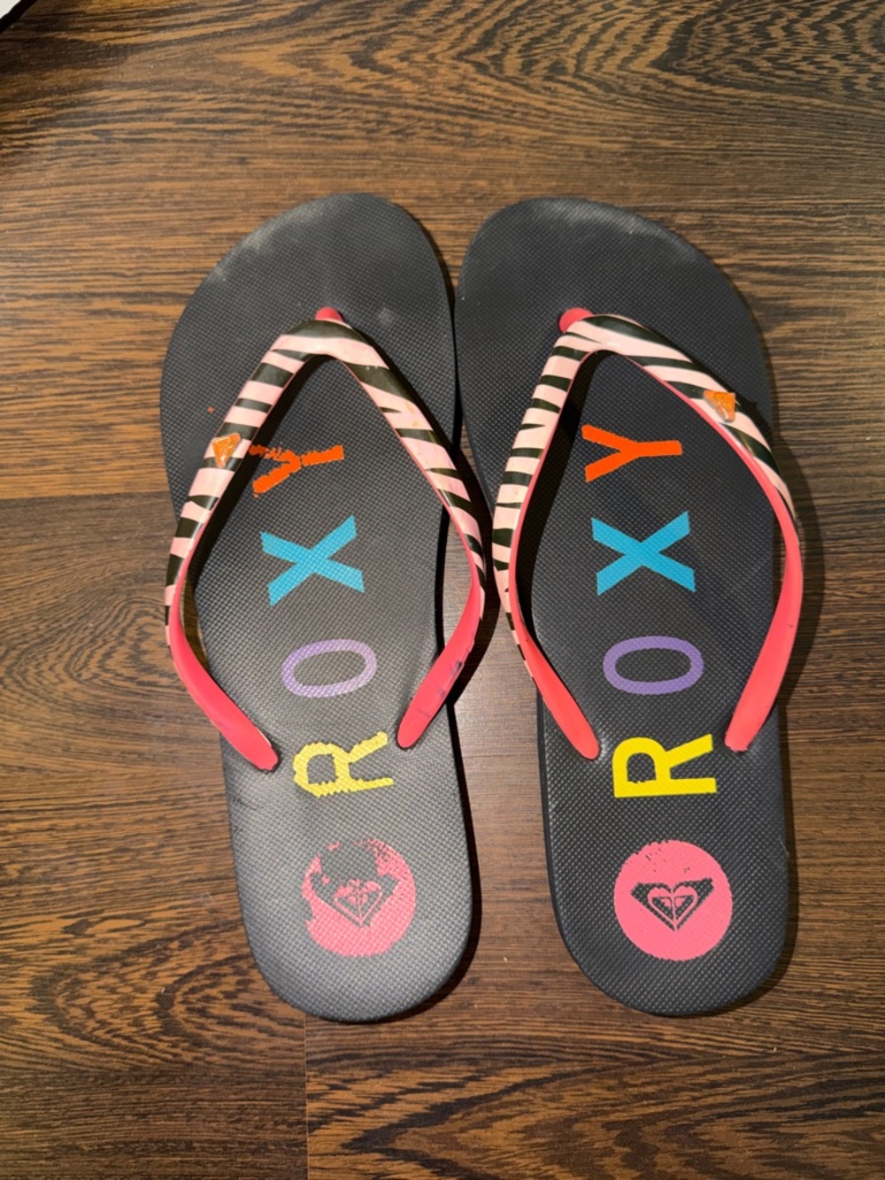 Roxy Black Flip Flops with Pink Zebra Straps and Multicolor Logos